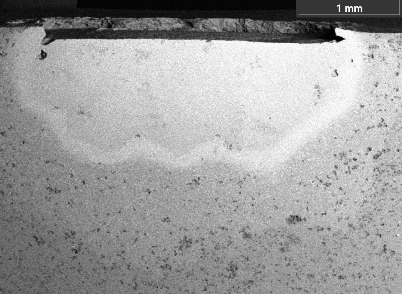 Поперечное сечение материала после проникновения в него меди и охлаждения